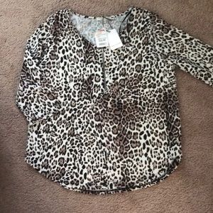 Leopard print half zip up blouse.